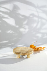 Natural wooden desk and podium on gray background with shadows. Empty showcase for packafing product presentation. Background for cosmetic products, Scene with dark shadows. Mock up pedestal. 