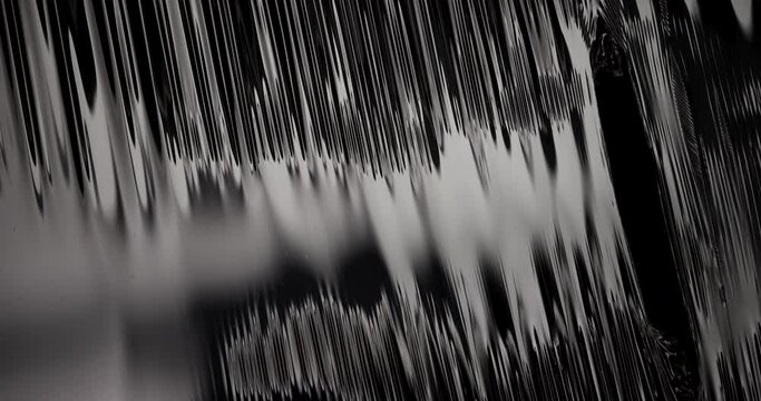 Plastic Stretchable Texture. The film breaks on a black background.