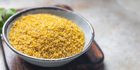 bulgur raw grain crop plant-based food healthy meal food snack diet on the table copy space food background rustic top view keto or paleo diet veggie vegan or vegetarian food