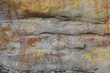 Aboriginal rock art: red schematic female figure-wallabies red and outlined. Ubirr-Kakadu-Australia-182