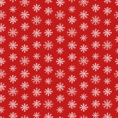 Cute snowflakes vector seamless pattern. Christmas snowflakes on red background.