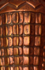 blurred background of an old bronze vase