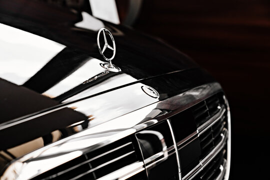 grid radiator and logo. a black Mercedes S class car. luxury cars.