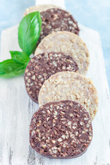 Traditional Irish and British black pudding and white or oatmeal pudding sausage, vertical