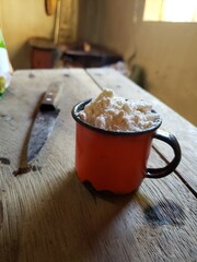 Kitchen with wood stove with pans for cookie recipe