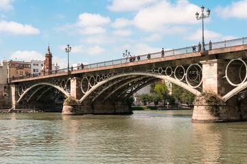Fototapeta na wymiar bridge of Triana in Seville, Andalusia, Spaim over the river Guadalquivir
