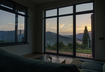 Stunning view of mountain at sunset from living room windows - obrazy, fototapety, plakaty