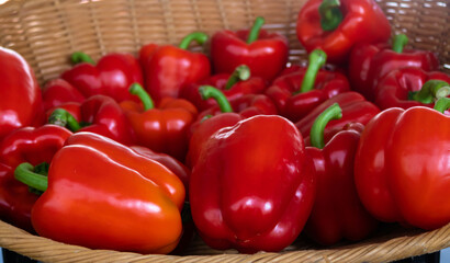 Close up of fresh red peppers in a basket at the market