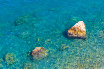 Very beautiful background or backdrop of sea water with rocky shore, selective focus