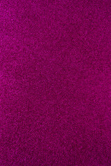 Background with sparkles. Backdrop with glitter. Shiny textured surface. Dark pink
