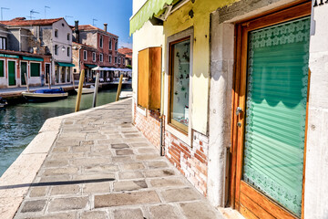 Murano, Italy - July 7, 2022: Scenery along the canals in Murano Italy
