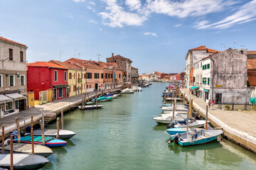 Fototapeta na wymiar Murano, Italy - July 7, 2022: Scenery along the canals in Murano Italy 