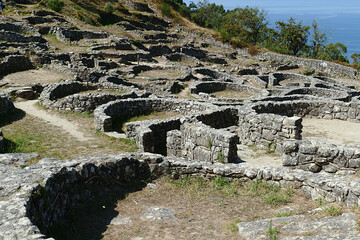 Ruins of ancient celtic settlement stone dwellings in Castro de Santa Trega archaeological site...
