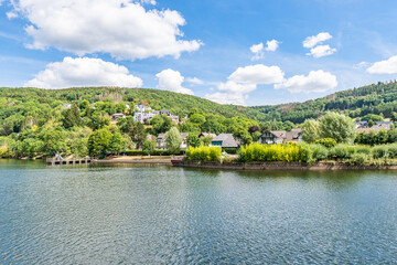 Some houses at the shore of lake Rursee, In the middle of the Eifel National Park, surrounded by unique natural scenery and unspoilt nature