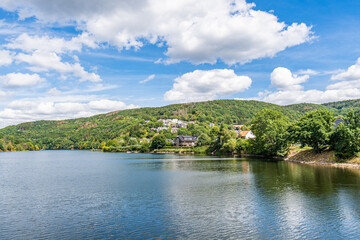 Some houses at the shore of lake Rursee, In the middle of the Eifel National Park, surrounded by unique natural scenery and unspoilt nature