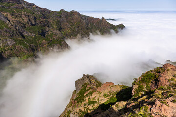 High up shot of Pico do Arieiro in Madeira with clouds