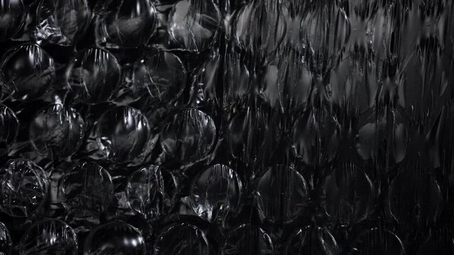 Bubble wrap over black background