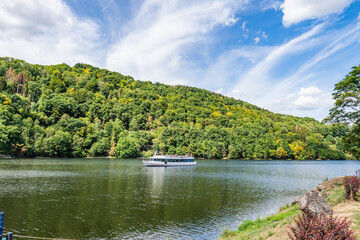 Boat with tourists on Lake Rursee, In the middle of the Eifel National Park, surrounded by unique natural scenery and unspoilt nature