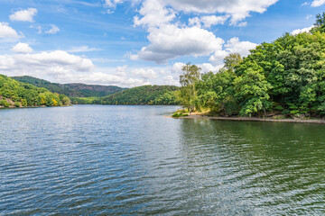 Fototapeta na wymiar Lake Rursee, In the middle of the Eifel National Park, surrounded by unique natural scenery and unspoilt nature