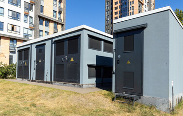 Grey high voltage transformer vault in the residential district