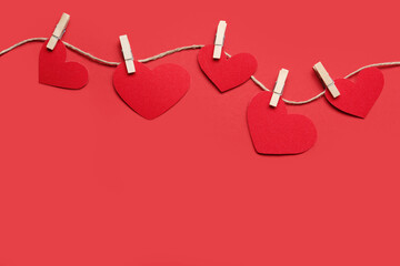 Twine with decorative hearts and space for text on red background, flat lay. Valentine's Day