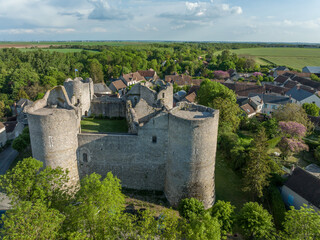 Aerial view of Yevre le chatel medieval feudal castle with round towers and village on a small...