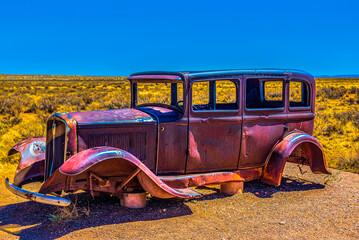 Side view of 1930's Vintage Auto on Route 66 at Painted Desert NP near Holbrook Arizona