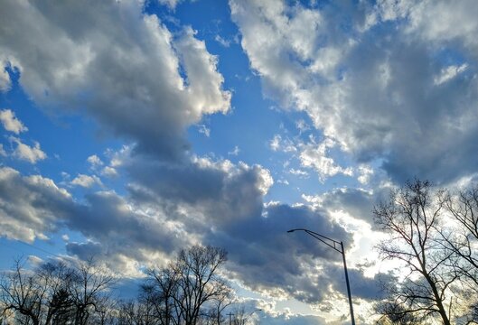 Bright Sunlit Cloudscape Over April Street