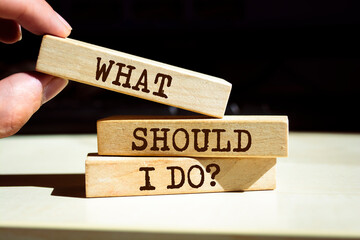 Wooden blocks with words 'What should I Do?'.