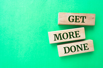 Wooden blocks with words 'Get More Done'.