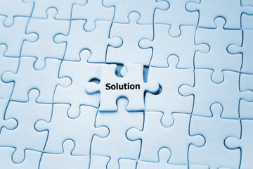 Business solution on jigsaw puzzle; solving problem concept