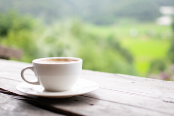 Coffee Cup on Table Against Landscape Scenery Mountain Hill Background