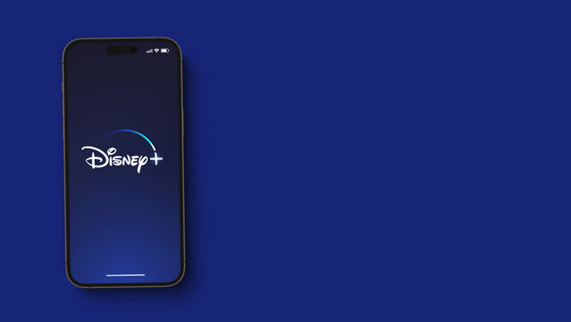 Disney Plus (Disney+) streaming app on the smartphone iPhone 14 Pro screen. Blue background. Rio de Janeiro, RJ, Brazil. September 2022