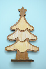 wooden christmas tree on blue background