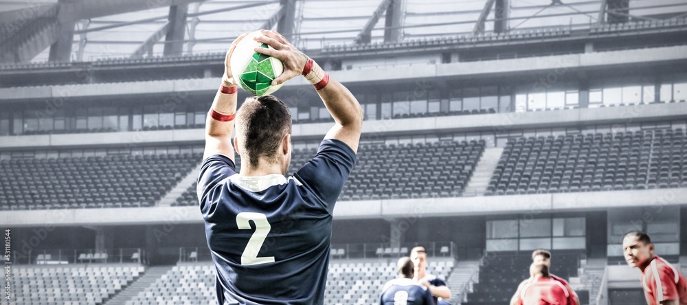 Poster Digital composite image of rugby player throwing the ball in sports stadium