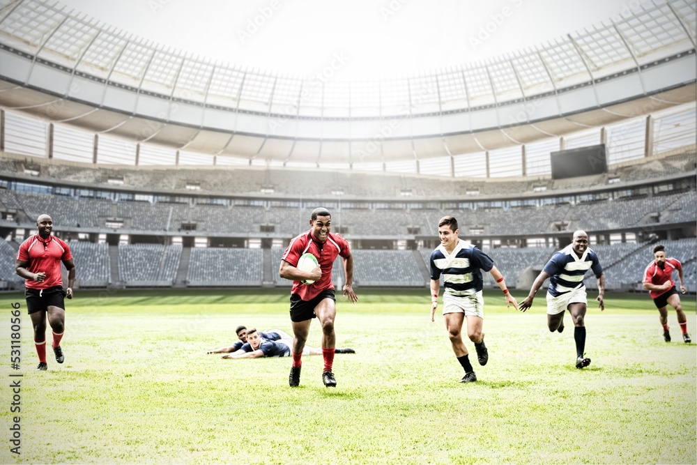 Canvas Prints Digital composite image of team of rugby players playing rugby in sports stadium