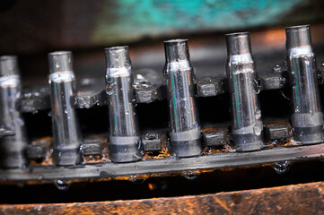 Shell casings transported by vintage equipment at plant