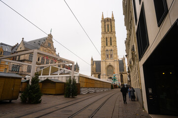 Fototapeta premium Saint Bavo's Cathedral , and Sint Baafsplein . Beautiful church and square in Ghent during winter cloudy day : Ghent , Belgium : November 30 , 2019