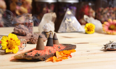 Incense Cones on Stone Slab With Crystals and Flowers