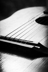 Old guitar with strings, close-up. Acoustic guitar music instrument