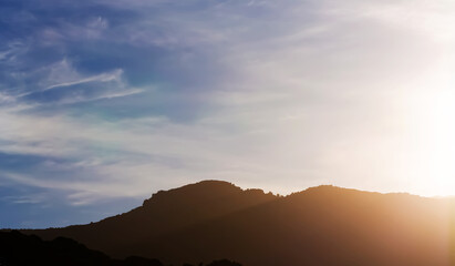 Cumulus and Stratus clouds in dramatic sunset sky
