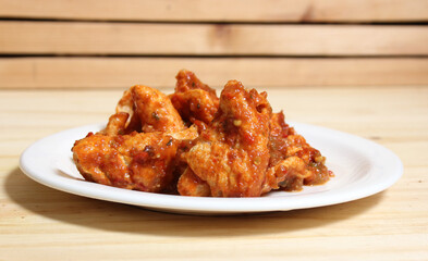 Fried Pork Skins With Red Salsa in Rustic Kitchen