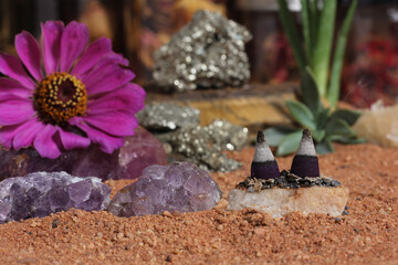 Fototapeta na wymiar Amethyst Crystals and Chakra Stones on Australian Red Sand. Meditation Table