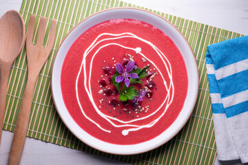 Vegan beet cream recipe decorated with flowers.
