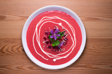 Vegan beet cream recipe decorated with flowers.