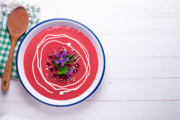 Vegan beet cream recipe decorated with flowers.