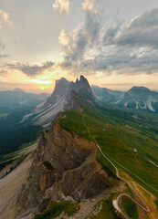 Naklejka premium Stunning view of the Seceda ridge during a cloudy day. The Seceda with its 2.500 meters is the highest vantage point in Val Gardena, Dolomites, Italy.
