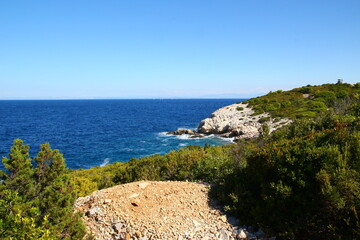Fototapeta na wymiar The landscape of the island of Vis, rocky beaches, steep cliffs, lonely islands