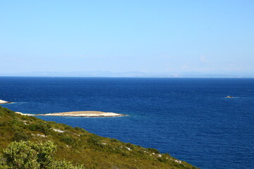 Fototapeta na wymiar The landscape of the island of Vis, rocky beaches, steep cliffs, lonely islands