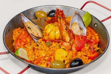 Spainsh dish seafood paella with rice, shrimps and mussels